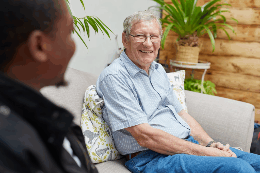 Caregiver offering emotional support through conversation.