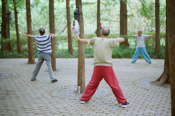 A group of people practicing yoga with adaptive props to improve flexibility and balance.