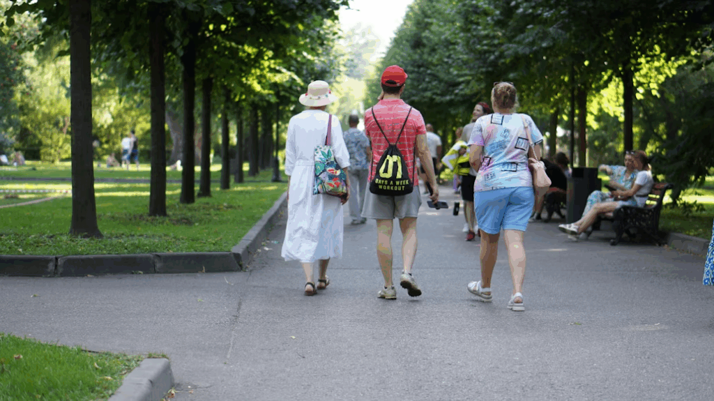 Elderly woman laughing during summer activities with her grandchildren