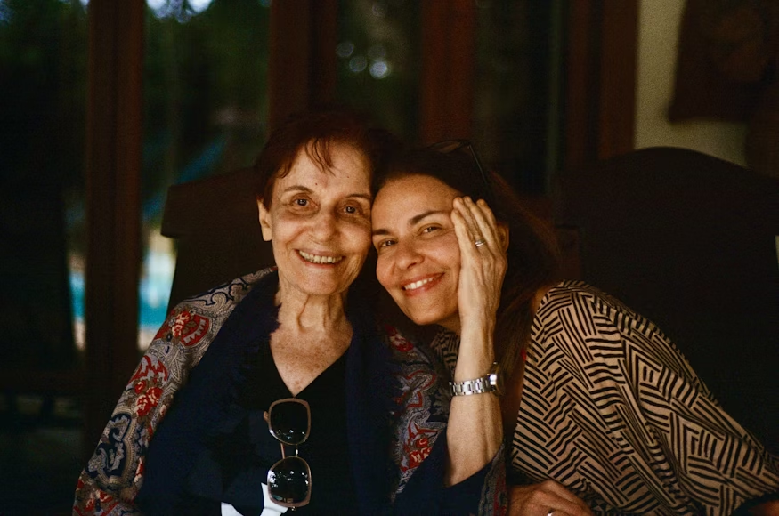 Caregiver and elder sharing safe, enjoyable summer activities indoors