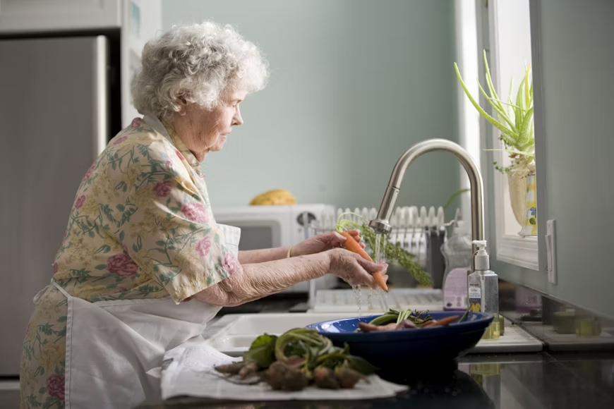 Senior friendly kitchen featuring ergonomic counters and lever-style handles