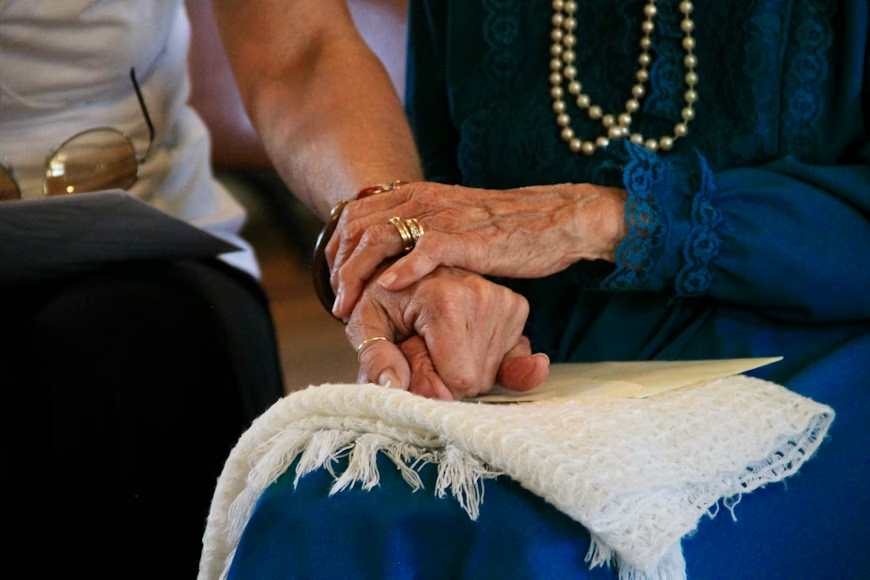 home care aide offering a listening ear to a woman in breast cancer recovery