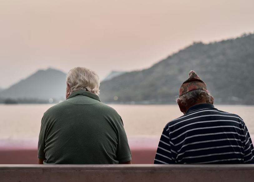 Caregiver providing companionship to senior at home