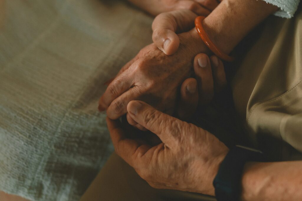 Caregiver helping elderly Indiana resident with daily living activities at home