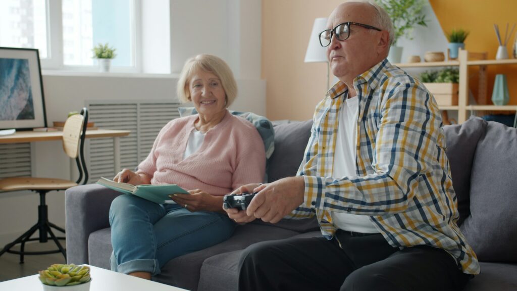 Elderly parent enjoying social interaction with family members to prevent loneliness and cognitive decline
