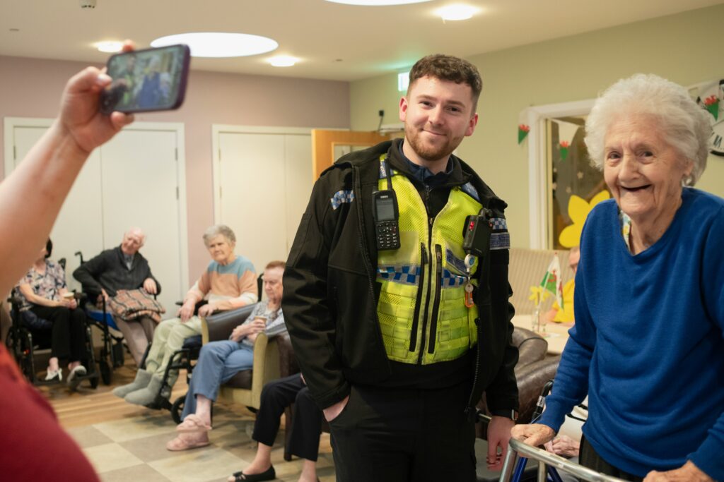 In-homecare support helping elderly patient with medication management at home