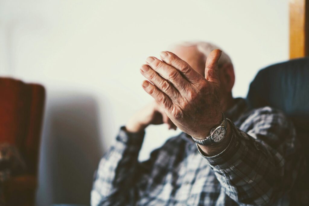 Family member noticing early signs of dementia in aging parent during dinner