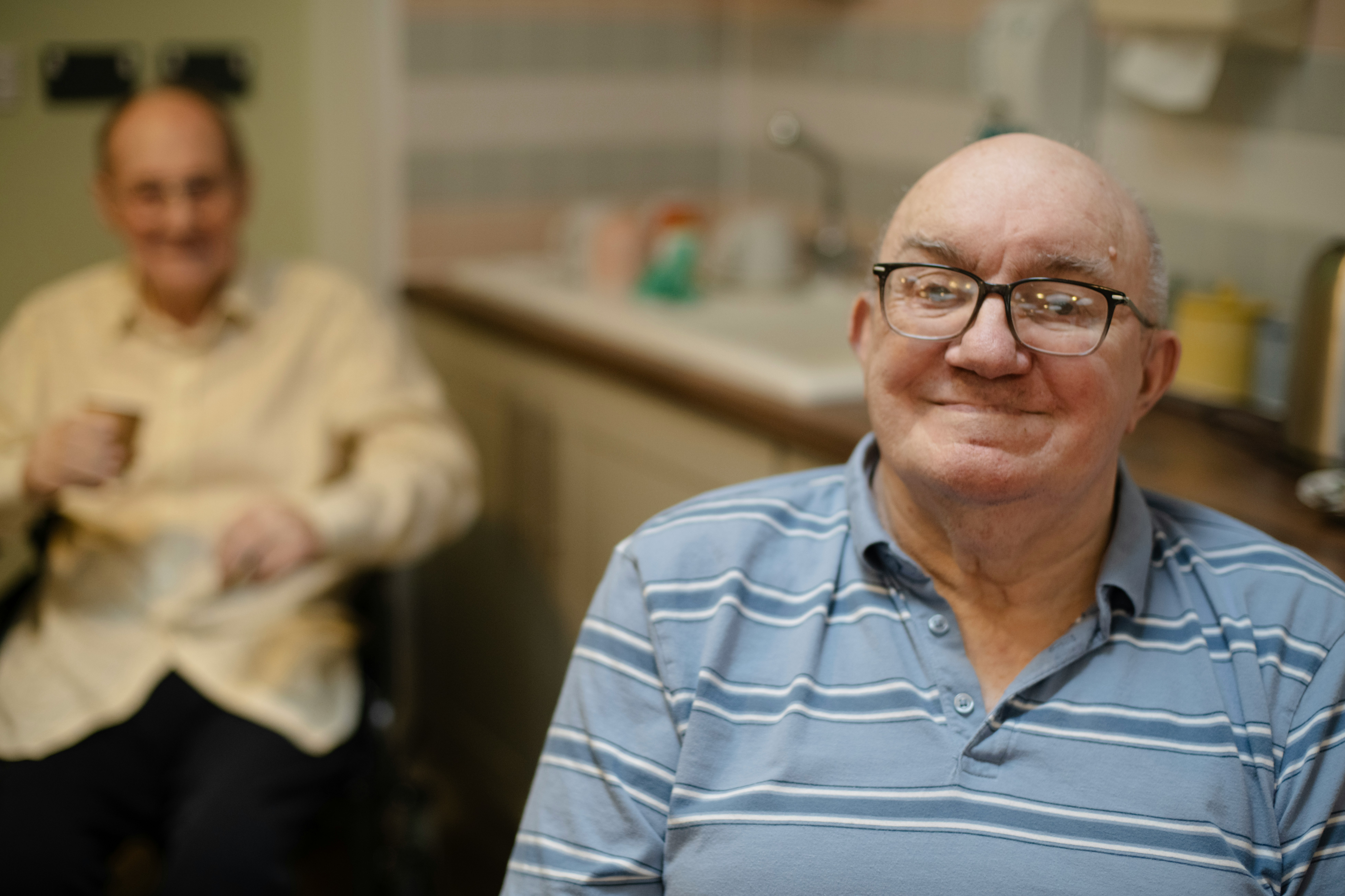 Home care aide assisting elderly patient under Indiana Medicaid waiver program
