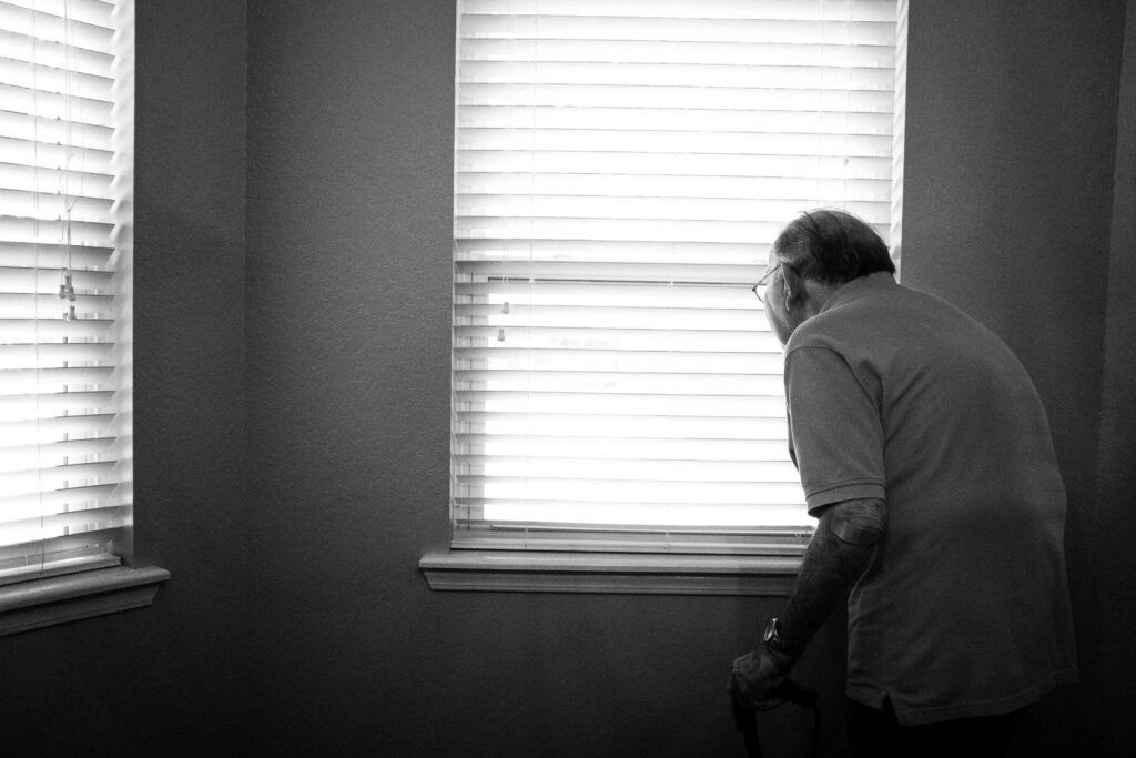 An adult daughter offering support to her father after recognizing signs elderly parent needs help.