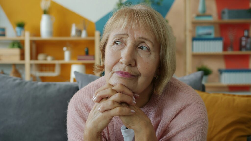 A senior woman getting assistance with personal care after family spotted signs elderly parent needs help.