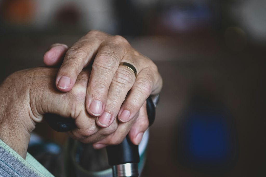 Adult daughter speaking with an older parent experiencing confusion