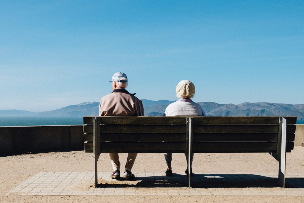 Adult daughter speaking with an older parent experiencing confusion