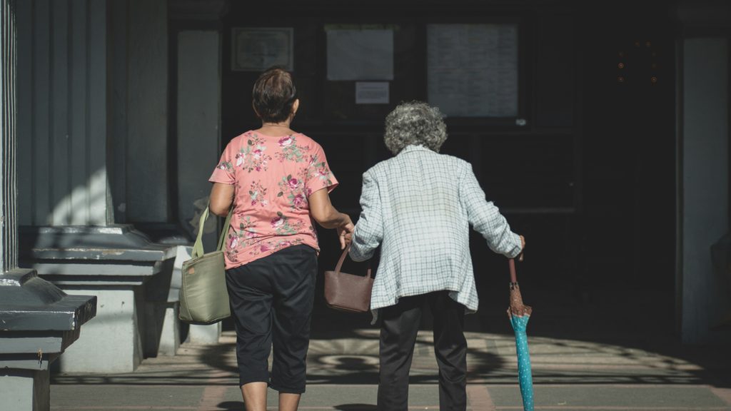 Older adult returning home with family after a hospital stay